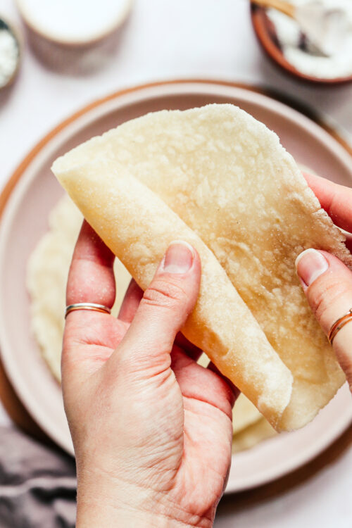 Rolling up a gluten-free flour tortilla
