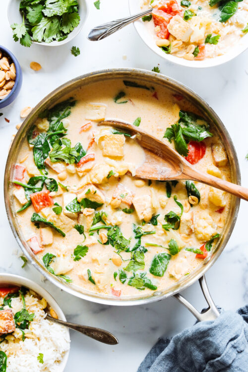 Skillet of vegetable panang curry with tofu