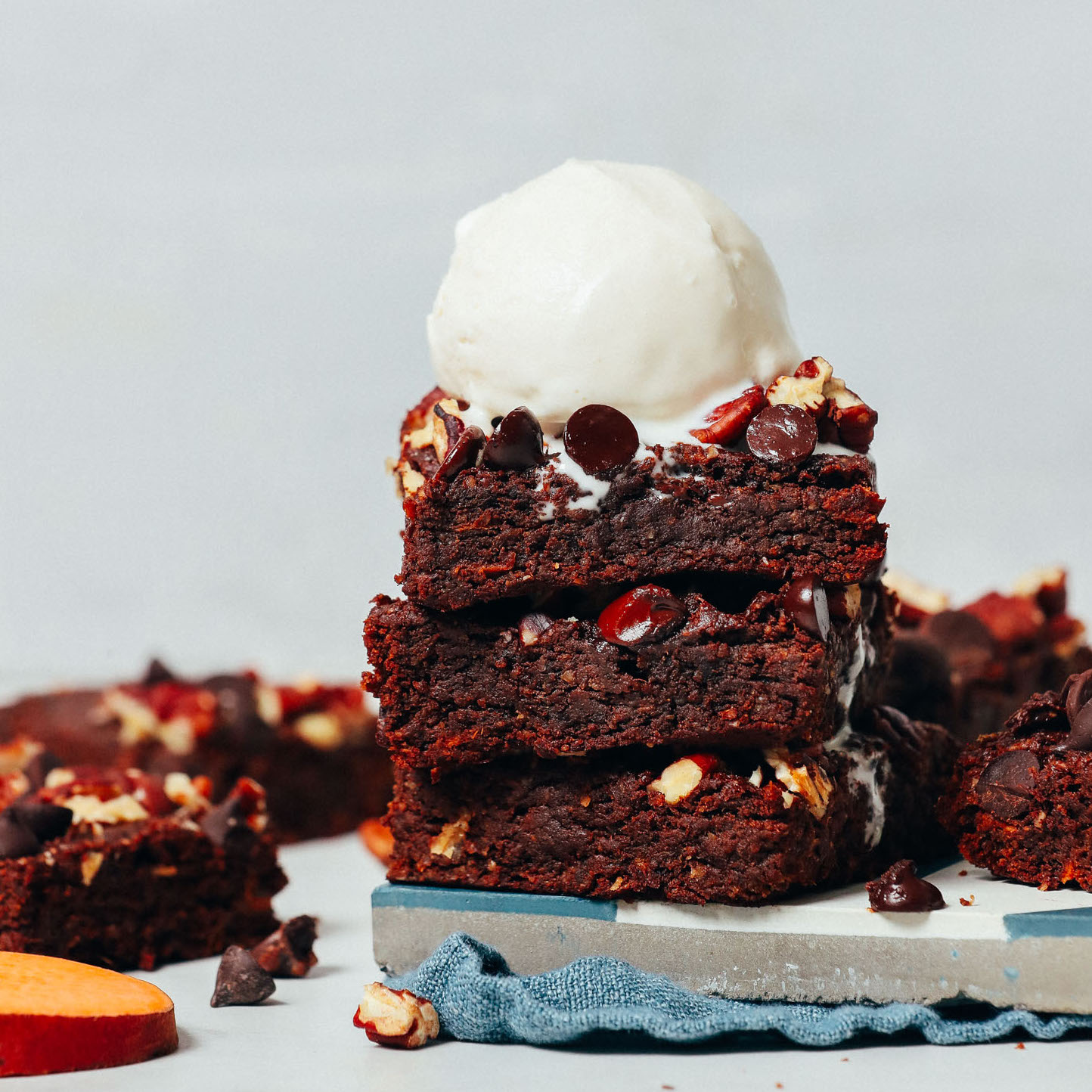 Stack of Sweet Potato Brownies topped with a scoop of vanilla ice cream