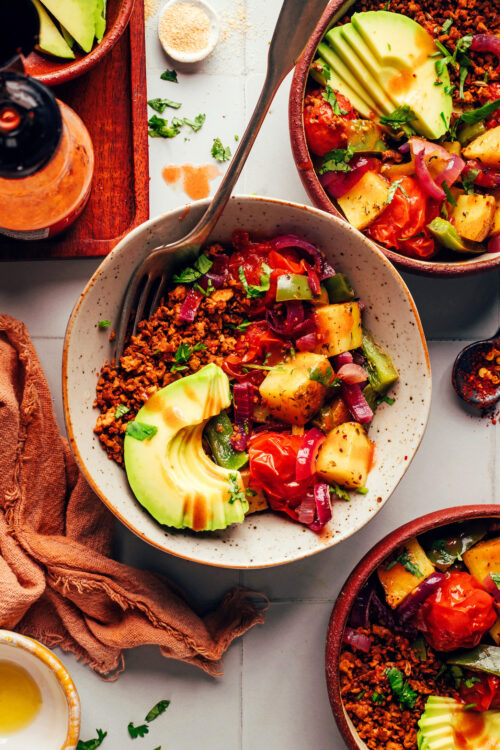 Vegan breakfast bowls with tempeh sausage crumbles, avocado, and roasted veggies